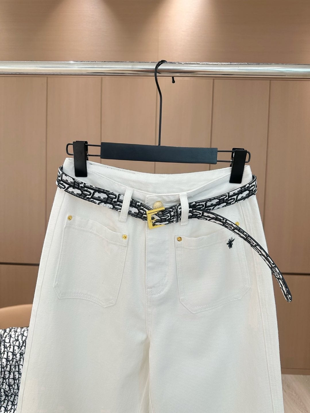 White jeans with logo on waist